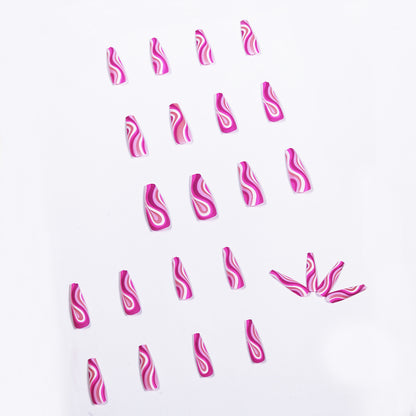 24 pieces of artistic press on nails in pink with swirling designs on a white background