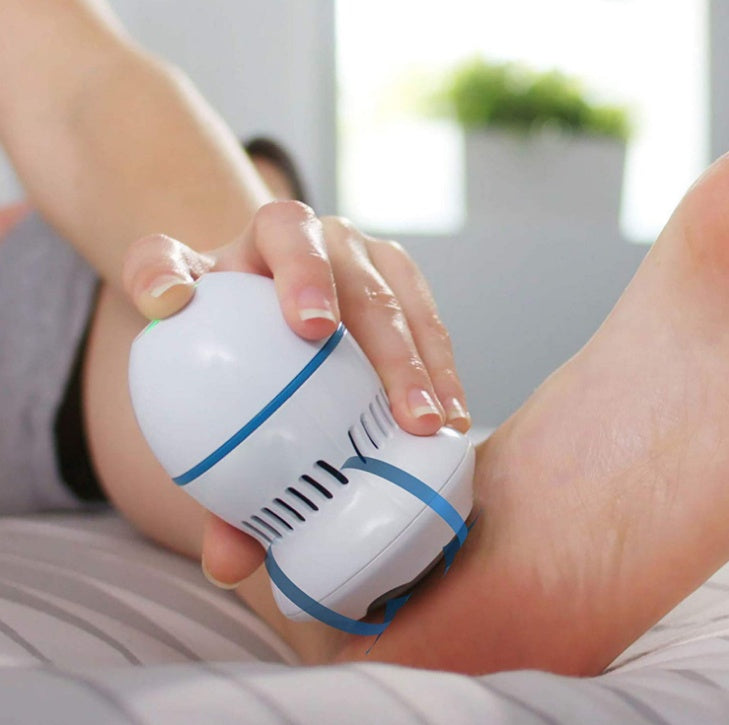 Person using a Multifunctional Electric Foot File Grinder Machine on foot for callus removal and smoothing skin.