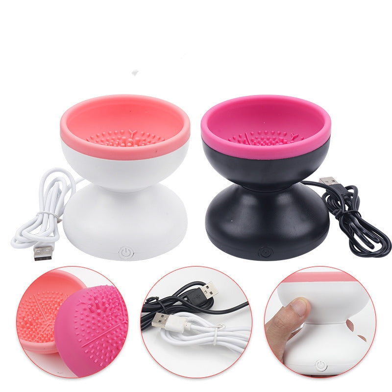 Electric Makeup Brush Cleaner Machine in pink and black with USB cable, designed for easy and efficient cleaning of beauty brushes.