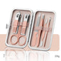 Professional Scissors Nail Clippers set in a sleek pink case, includes nail clippers, scissors, and grooming tools.